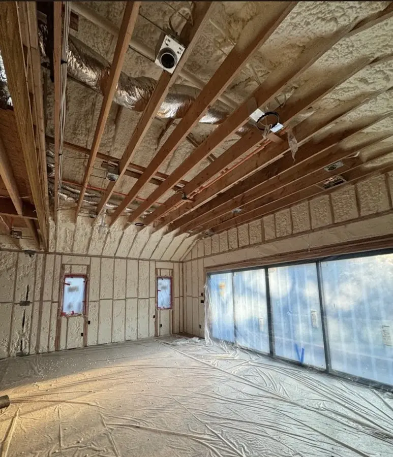 Interior walls and ceiling insulated with spray foam during new construction in Shorewood